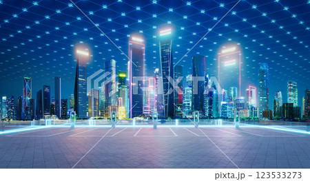 Electric vehicle charging station parking lot with city skyline and digital grid connecting buildings Electric vehicle charging station parking lot with city skyline and digital grid connecting buildings 123533273