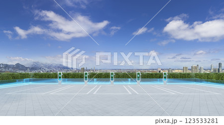 Electric vehicle charging stations on rooftop parking with city view Electric vehicle charging stations on rooftop parking with city view 123533281