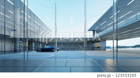 Modern glass building with parked car reflecting corporate success 123533285