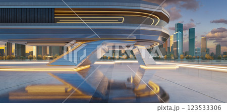 Futuristic building with illuminated floor overlooking city skyline at sunset 123533306