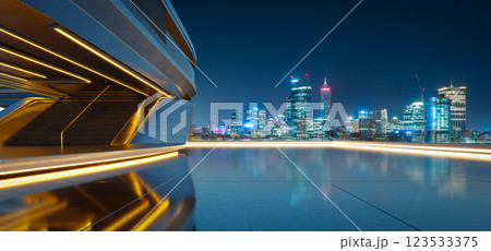 3D Futuristic building overlooking illuminated cityscape at night 123533375