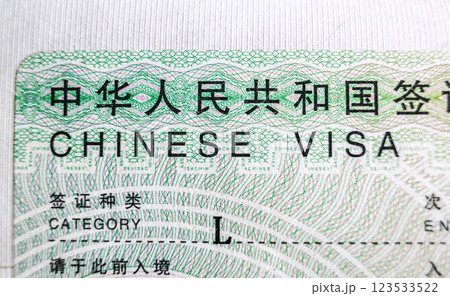 Chinese visa in foreign passport for tourism and travel in China 123533522