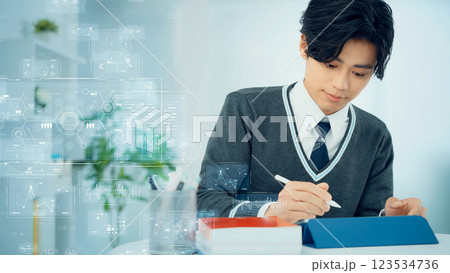 タブレットを使って勉強する学生とデジタルデータイメージ タブレットを使って勉強する学生とデジタルデータイメージ 123534736