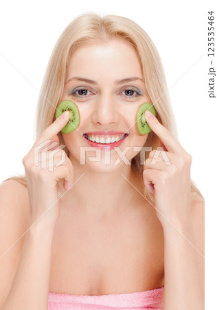 Woman getting fruit cosmetic facial mask 123535464
