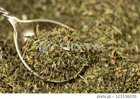 Savory herb seasoning in a spoon macro 123536030