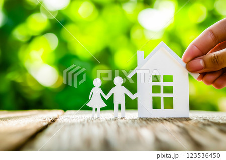 Paper cut of family with blurred green background with bokeh 123536450