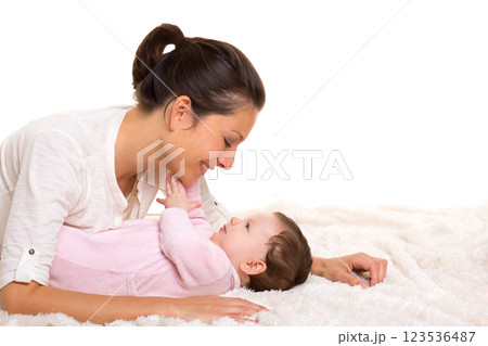 Baby girl and mother lying happy playing together 123536487