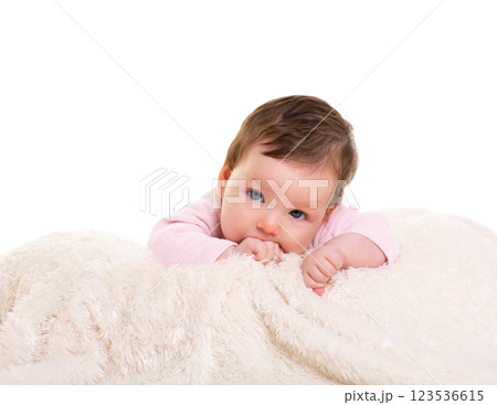 baby girl with toothache in pink with on white fur baby girl with toothache in pink with on white fur 123536615