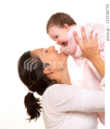 Baby girl hug in mother arms playingin happy on white Baby girl hug in mother arms playingin happy on white 123536779