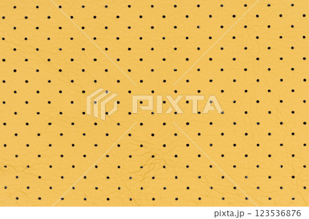 Yellow color abstract artificial leather with small dots and holes pattern for background Yellow color abstract artificial leather with small dots and holes pattern for background 123536876
