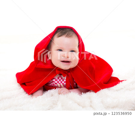 Baby Little Red Riding Hood on white fur 123536950