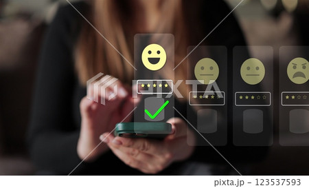 Woman holds smartphone giving good review at cafe. Close up on female hand holding smartphone rating of the quality of service,store, service and social networks. Graphic animation. 123537593