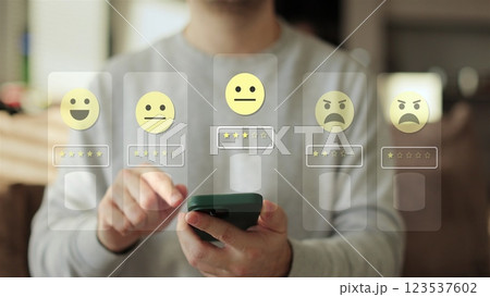 Close-up of man hands using smartphone, rating of the quality of service,store, service and social networks. Satisfaction survey concept reviews customer quality assessment. 123537602