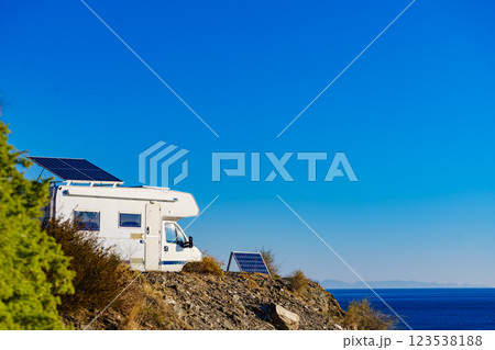 Caravan with tilt solar panels on roof. 123538188
