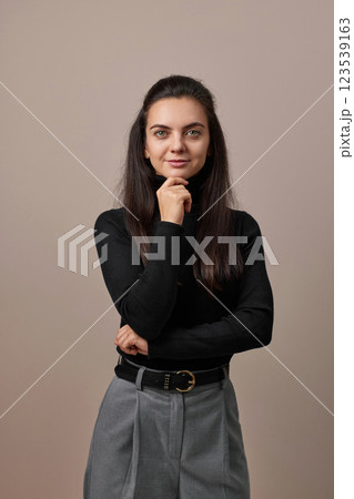 pretty businesswoman lady with crossed arms isolated on gray background pretty businesswoman lady with crossed arms isolated on gray background 123539163
