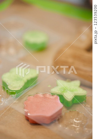 green and pink handmade soap in plastic mold green and pink handmade soap in plastic mold 123539200