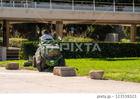 In the city park, a special car with an employee In the city park, a special car with an employee 123539323