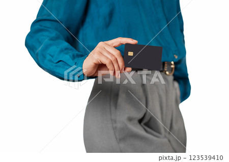 female hand holding black premium credit bank card on white background. digital business finance and payment online, mock up 123539410