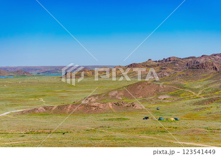 An off-road tourist trip to the mountains of Almaty. picnic on four-wheel drive cars in the steppe 123541449