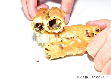 A bun made from puff pastry with filling. A bun made from puff pastry with filling. 123542122