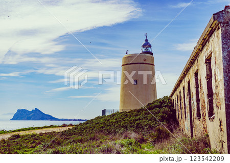 Lighthouse and Gibraltar rock, La Alcaidesa, Spain. Lighthouse and Gibraltar rock, La Alcaidesa, Spain. 123542209