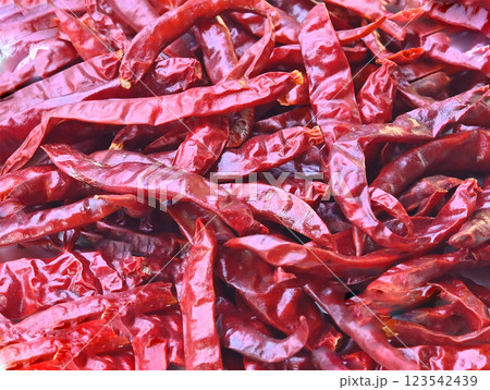 Dried red chili Thai spice hot pepper chili ingredient cooking, top view drying chilis background. Dried red chili Thai spice hot pepper chili ingredient cooking, top view drying chilis background. 123542439