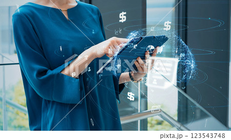 タブレットを使う女性とネットワークイメージ タブレットを使う女性とネットワークイメージ 123543748