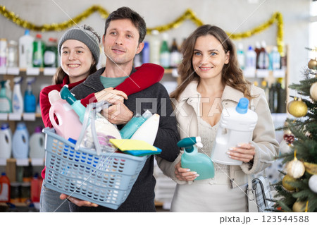 Portrait of family with full shopping basket in supermarket before christmas 123544588