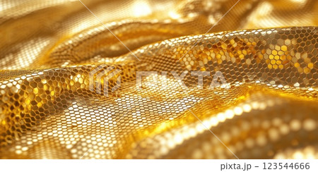 Shimmering golden fabric drapes elegantly, capturing light in a captivating display of texture and color 123544666