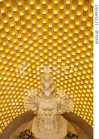 A stunning statue is beautifully illuminated beneath a golden glow, creating an enchanting ambiance A stunning statue is beautifully illuminated beneath a golden glow, creating an enchanting ambiance 123546163