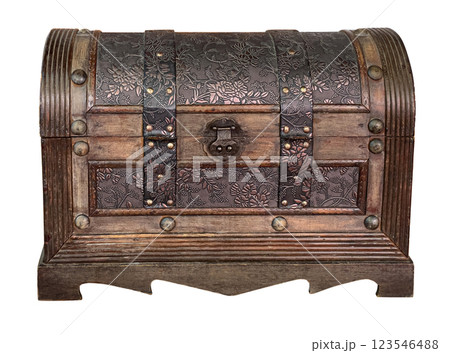 Closed wooden hope chest displaying floral metal decoration and rivets 123546488