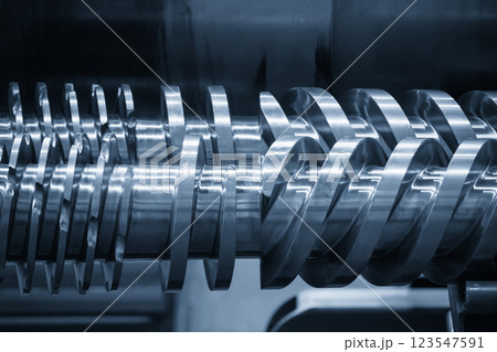 Close up scene body of the barrel screw of injection machine spare parts in the light blue scene. 123547591