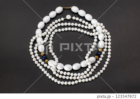 Unique necklace for women on a black background, promotional photo for an online vintage and handmade jewelry store  123547672