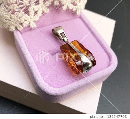 Unique necklace for women on a pink background, promotional photo for an online vintage and handmade jewelry store 123547708