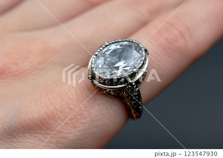 Statement ring for women on a black background, fine jewelry concept, promotional photo for an online vintage and handmade jewelry store Statement ring for women on a black background, fine jewelry concept, promotional photo for an online vintage and handmade jewelry store 123547930