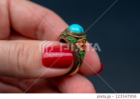 Statement ring for women on a black background, fine jewelry concept,  promotional photo for an online vintage and handmade jewelry store 123547956