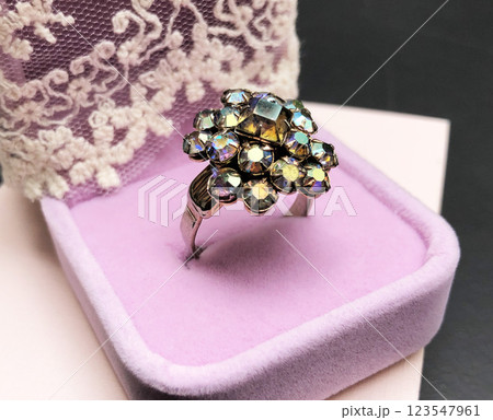 Statement ring for women on a black background, fine jewelry concept, promotional photo for an online vintage and handmade jewelry store Statement ring for women on a black background, fine jewelry concept, promotional photo for an online vintage and handmade jewelry store 123547961