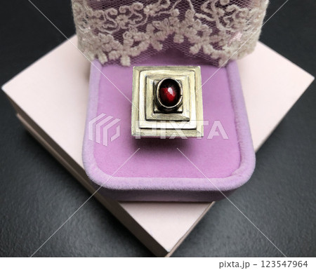 Statement ring for women on a black background, fine jewelry concept, promotional photo for an online vintage and handmade jewelry store Statement ring for women on a black background, fine jewelry concept, promotional photo for an online vintage and handmade jewelry store 123547964