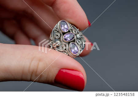 Statement ring for women on a black background, fine jewelry concept, promotional photo for an online vintage and handmade jewelry store Statement ring for women on a black background, fine jewelry concept, promotional photo for an online vintage and handmade jewelry store 123548158