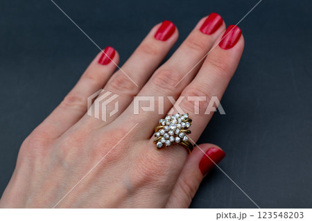 Statement ring for women on a black background, fine jewelry concept, promotional photo for an online vintage and handmade jewelry store Statement ring for women on a black background, fine jewelry concept, promotional photo for an online vintage and handmade jewelry store 123548203