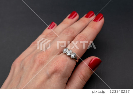 Statement ring for women on a black background, fine jewelry concept,  promotional photo for an online vintage and handmade jewelry store 123548237
