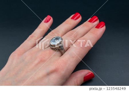 Statement ring for women on a black background, fine jewelry concept,  promotional photo for an online vintage and handmade jewelry store 123548249