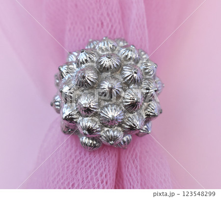 Statement ring for women on a pink background, fine jewelry concept,  promotional photo for an online vintage and handmade jewelry store 123548299