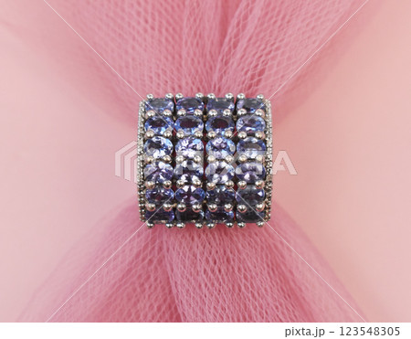 Statement ring for women on a pink background, fine jewelry concept, promotional photo for an online vintage and handmade jewelry store Statement ring for women on a pink background, fine jewelry concept, promotional photo for an online vintage and handmade jewelry store 123548305