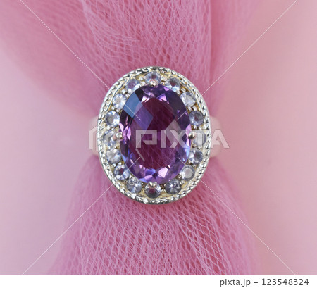 Statement ring for women on a pink background, fine jewelry concept,  promotional photo for an online vintage and handmade jewelry store 123548324