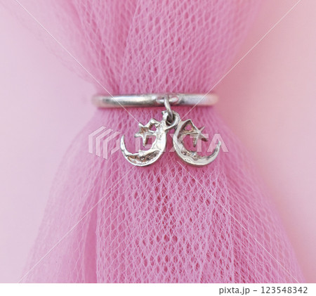 Statement ring for women on a pink background, fine jewelry concept, promotional photo for an online vintage and handmade jewelry store Statement ring for women on a pink background, fine jewelry concept, promotional photo for an online vintage and handmade jewelry store 123548342