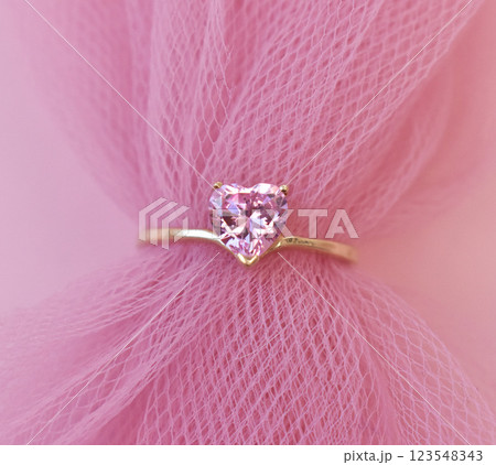 Statement ring for women on a pink background, fine jewelry concept,  promotional photo for an online vintage and handmade jewelry store 123548343
