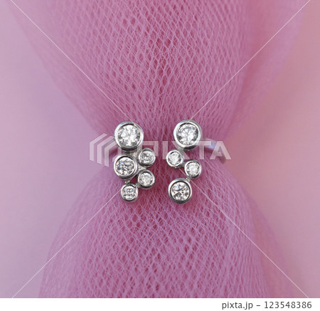 Statement ring for women on a pink background, fine jewelry concept, promotional photo for an online vintage and handmade jewelry store Statement ring for women on a pink background, fine jewelry concept, promotional photo for an online vintage and handmade jewelry store 123548386