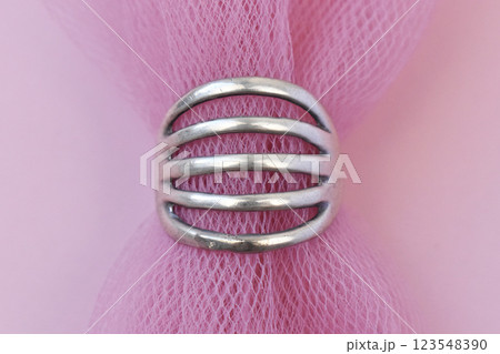 Statement ring for women on a pink background, fine jewelry concept, promotional photo for an online vintage and handmade jewelry store Statement ring for women on a pink background, fine jewelry concept, promotional photo for an online vintage and handmade jewelry store 123548390