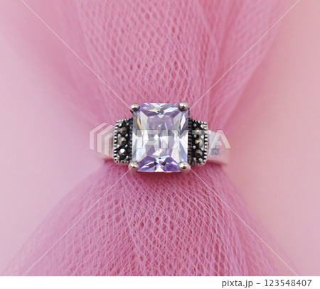 Statement ring for women on a pink background, fine jewelry concept,  promotional photo for an online vintage and handmade jewelry store 123548407